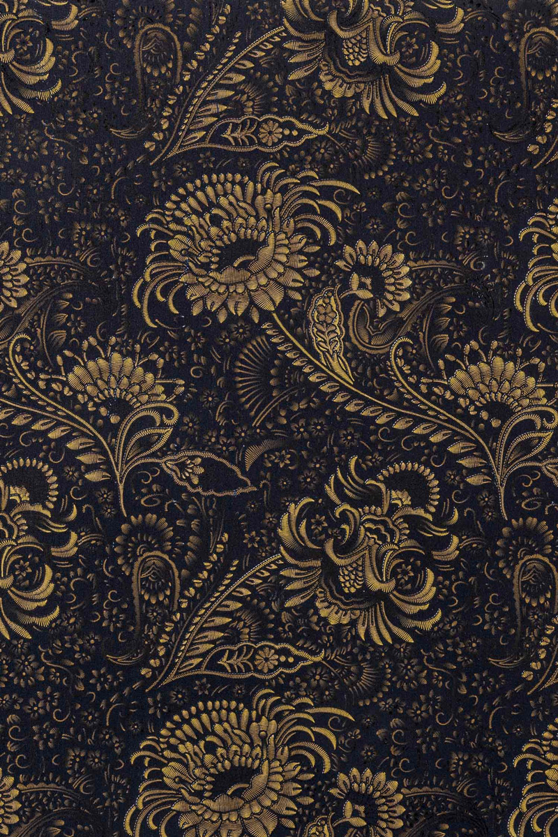 Stoff schwarz-goldenes Muster